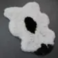 Icelandic Sheepskin Rug IMX132 (5) Shorn Icelandic sheepskin rug with natural white wool and large black markings in a unique organic shape.