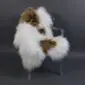 Icelandic Sheepskin Rug ISM388 (2) Long-haired Icelandic sheepskin rug with white and brown patches laid flat.