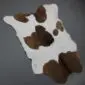 Calfskin Rug CF168a (4) Natural calfskin rug with white fur and irregular dark brown patches.