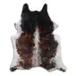 Natural shaped cowhide rug with dark brown and black brindle markings on a white background.