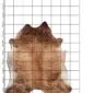 Cowhide Rug C00999 a (1) Natural cowhide rug in shades of beige and brown with an irregular shape, displayed .
