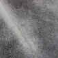 Natural grey cowhide rug with an irregular shape and mottled hair-on-hide texture.