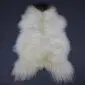 ICL-CurlyMix-lrg-13 (2) Long-haired white Icelandic sheepskin rug with a dark brown spot at the top and curly wool texture.