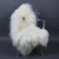 Off-white Icelandic sheepskin rug with long, shaggy wool laid flat.