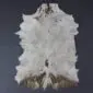 Natural goatskin rug with white fur and brown markings along the lower edge.