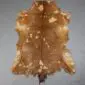 Goatskin Rug G1013 (2) Natural goatskin rug with tan and brown fur featuring white dappled spots and an irregular organic shape.