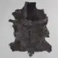 Goatskin Rug G1045 (2) Natural goatskin rug with dark brown and black textured fur in an irregular hide shape.
