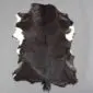 Goatskin Rug G1064 (2) Natural goatskin rug with dark brown and black fur featuring white patches on the edges.