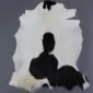 Goatskin Rug G1065 (2) Natural goatskin rug with white fur and large black patches.