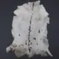 Goatskin Rug G1076 (2) Natural white goatskin rug with grey and brown markings and a dark dorsal stripe on a black background.
