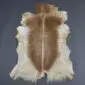 Goatskin Rug G1088 (2) Natural goatskin rug with a light brown centre and cream edges on a grey background.