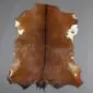 Goatskin Rug G1089 (2) Natural goatskin rug with brown and white mottled fur and a dark central stripe.