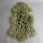 Khaki Mongolian lambskin rug with long, curly wool fibres and a natural hide shape.