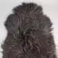 ICL-CURLY Blacky Brown (3) Natural curly Icelandic sheepskin rug in a dark blackish brown tone with long textured wool.