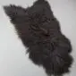 ICL-CURLY Blacky Brown (4) Natural curly Icelandic sheepskin rug in dark blackish brown with a thick, textured wool pile.