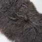 ICL-CURLY Blacky Brown (6) Close-up of a dark brown Icelandic sheepskin rug with long, curly natural wool fibres.