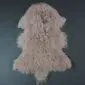 IMG_3526 Camel-coloured Mongolian lambskin rug with long, curly wool fibres and a natural hide shape.