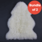 Ivory Sheepskin Bundle of 2 Two ivory white sheepskin rugs with thick wool pile and natural curved edges .
