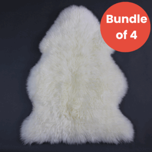 Ivory white sheepskin rug with a natural pelt shape and thick wool pile, featuring a red bundle of 4 badge.