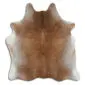 Natural cowhide rug with a speckled tan and grey pattern and an irregular organic shape.