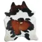 Natural tricolour cowhide rug with white, black and chestnut brown patches in a unique organic shape.
