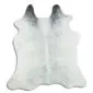 Natural shaped cowhide rug in light grey with dark charcoal grey markings at the top.