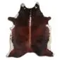 Natural shaped cowhide rug with dark brown brindle patterns and white edges.