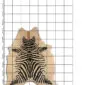 Natural shaped cowhide rug with a black and white zebra print over a beige background.