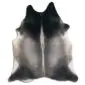 Natural shaped cowhide rug with a gradient of black, grey, and white tones and a central vertical stripe.