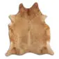 Natural cowhide rug in exotic beige with speckled tan and cream patterns and an irregular organic shape.
