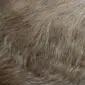Close-up of a beige and brown exotic cowhide rug showing natural hair texture and colour variations.