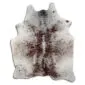 Natural cowhide rug with white base and brown speckled pattern in a salt and pepper style.