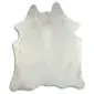 Irregularly shaped natural white cowhide rug with short hair texture and subtle cream tones.