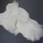 Large multi-layered white sheepskin rug with a thick, textured wool pile and irregular natural edges.