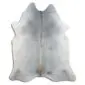 Natural cowhide rug with a grey and tan speckled pattern and organic curved edges.