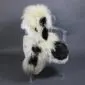 Large multi-layered sheepskin rug with long white and black wool laid flat.