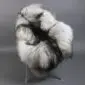 Long-haired Icelandic sheepskin rug with natural grey, white and black wool laid flat.