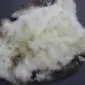 Natural rare breed sheepskin rug with thick cream wool and dark brown mottled edges. detail view