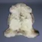 Natural rare breed sheepskin rug with cream wool and grey and brown mottled markings.