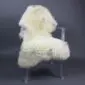 Cream rare breed sheepskin rug with thick, textured wool laid flat.