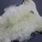 Natural cream and grey rare breed sheepskin rug with long, textured wool pile.